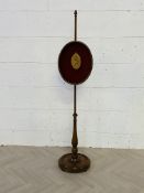 A mahogany framed rise and fall polescreen