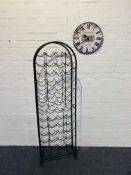Two items to include a contemporary black powder coated metal arch top fifty bottle wine rack