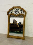 A large contemporary wicker work wall mirror