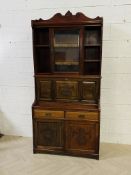 A late Victorian carved mahogany secretaire cabinet