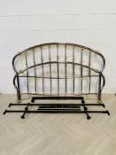 An attractive large antique style polished metal and brass king size bed frame
