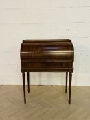 A reproduction inlaid cylinder writing desk