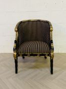 One of a pair, a decorative black lacquered and gilt antique style upholstered open armchair