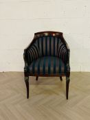 A decorative antique style upholstered open armchair