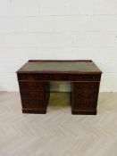 A good quality Victorian rounded corner mahogany three part pedestal desk