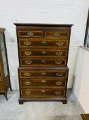 An antique style mahogany tallboy