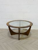 A mid century teak 'Astro' coffee table with an inset circular glass top
