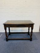 A solid oak antique 17th century style side table