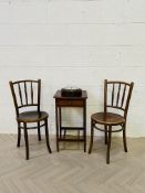 A collection of four items to include an early 20th century carved oak circular aneroid barometer