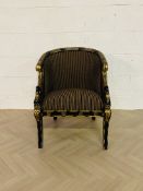 One of a pair, a decorative black lacquered and gilt antique style upholstered open armchair