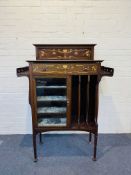 In the manner of Shapland & Petter, a stylish Art Nouveau inlaid mahogany music cabinet