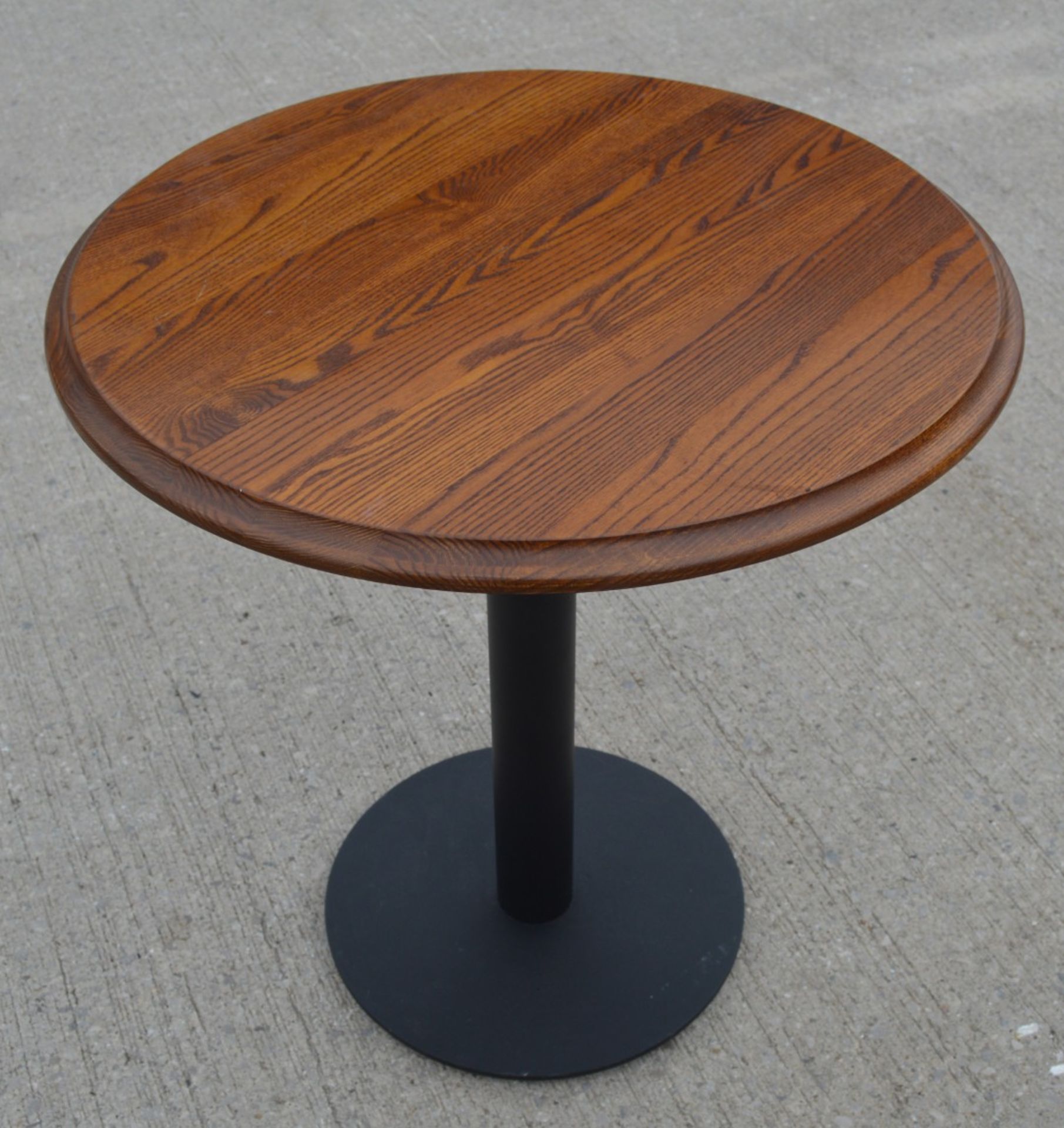 1 x Restaurant Table Featuring a Stained Round Wooden Top and Black Pedestal - Dimensions: H77 x W70 - Image 2 of 3