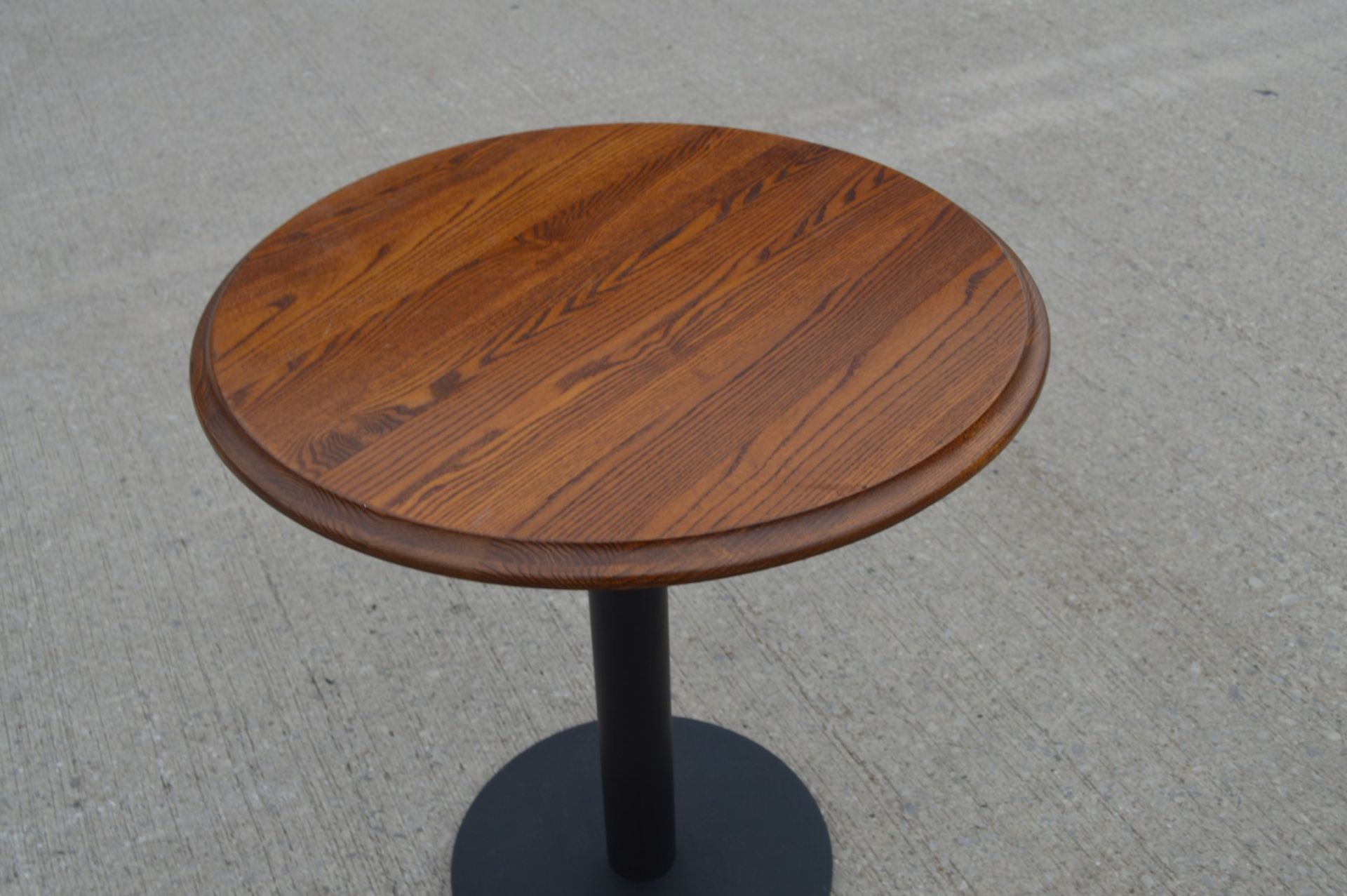 1 x Restaurant Table Featuring a Stained Round Wooden Top and Black Pedestal - Dimensions: H77 x W70 - Image 3 of 3