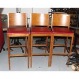 3 x  Restaurant Bar Stools Featuring Wooden Backrests, Footrests and Red Faux Leather Seating Pads