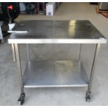 1 x Stainless Steel Mobile Prep Table Featuring Castor Wheels, Can Opener and Undershelf