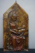 Unusual bas-relief/plaque in stucco. Depicting the Madonna and Child. The whole is firmly encased in