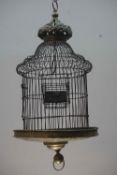 Unusual birdcage in brass and wrought iron, richly decorated bottom and crowned top, Flanders 17th