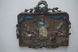 Polychrome, framed bas-relief in wood. The central figure depicts Mary holding a cross and