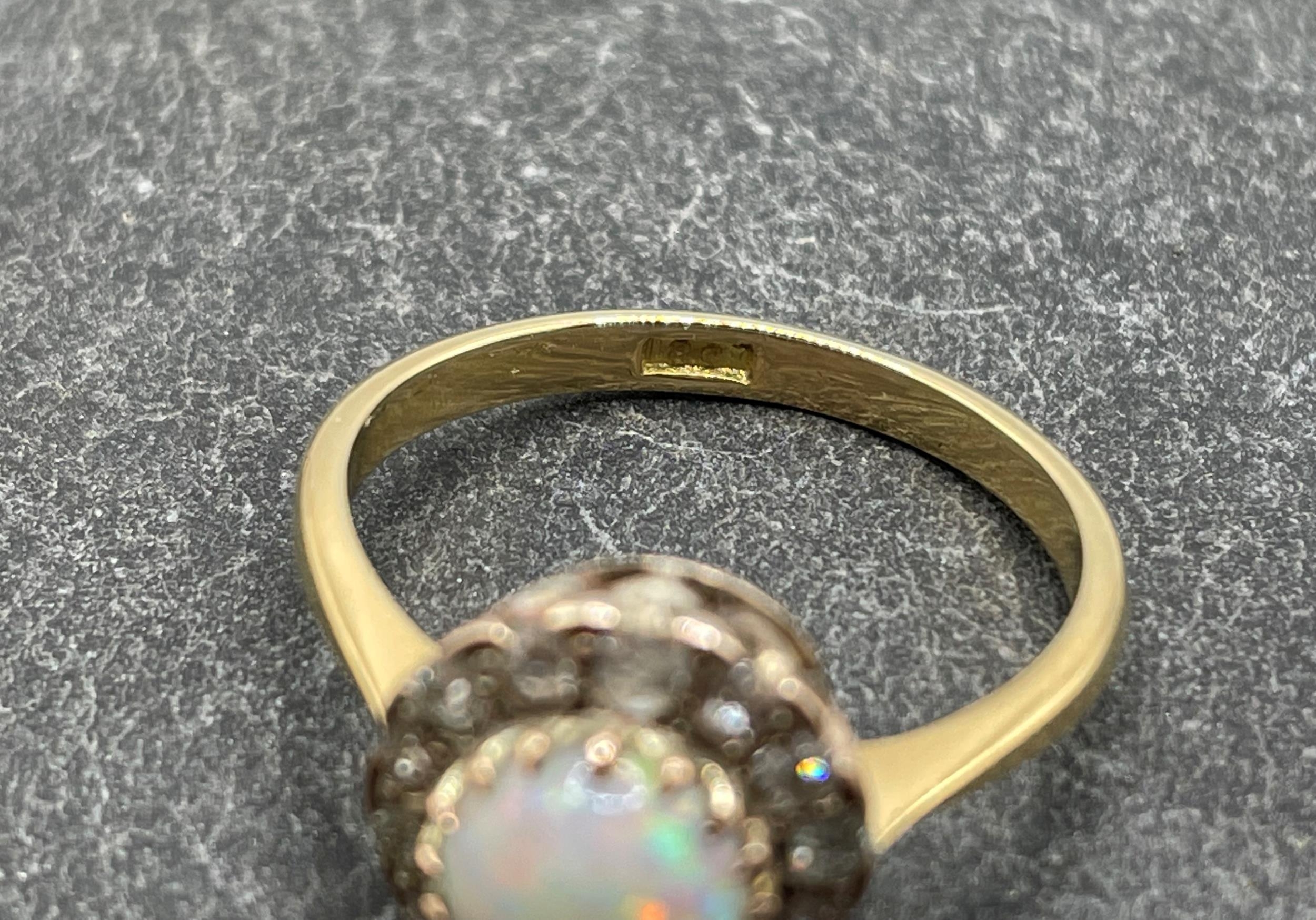 18ct opal and diamond dress ring, central 1.2ct opal framed by fourteen brilliant diamonds, size - Image 4 of 5