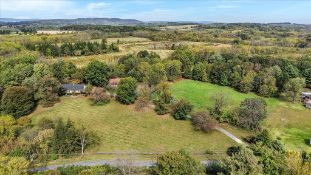 3.16 Acre, Partly Wooded, Level Lot with a 24’ x 44’ 4-Bay Garage