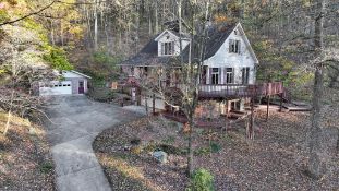 4 BED, 2½ BATH HOUSE W/DETACHED GARAGE ON 12.6 +/- AC WOODED LO