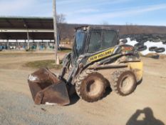 2013 New Holland L220 skid loader with material bucket. one owner