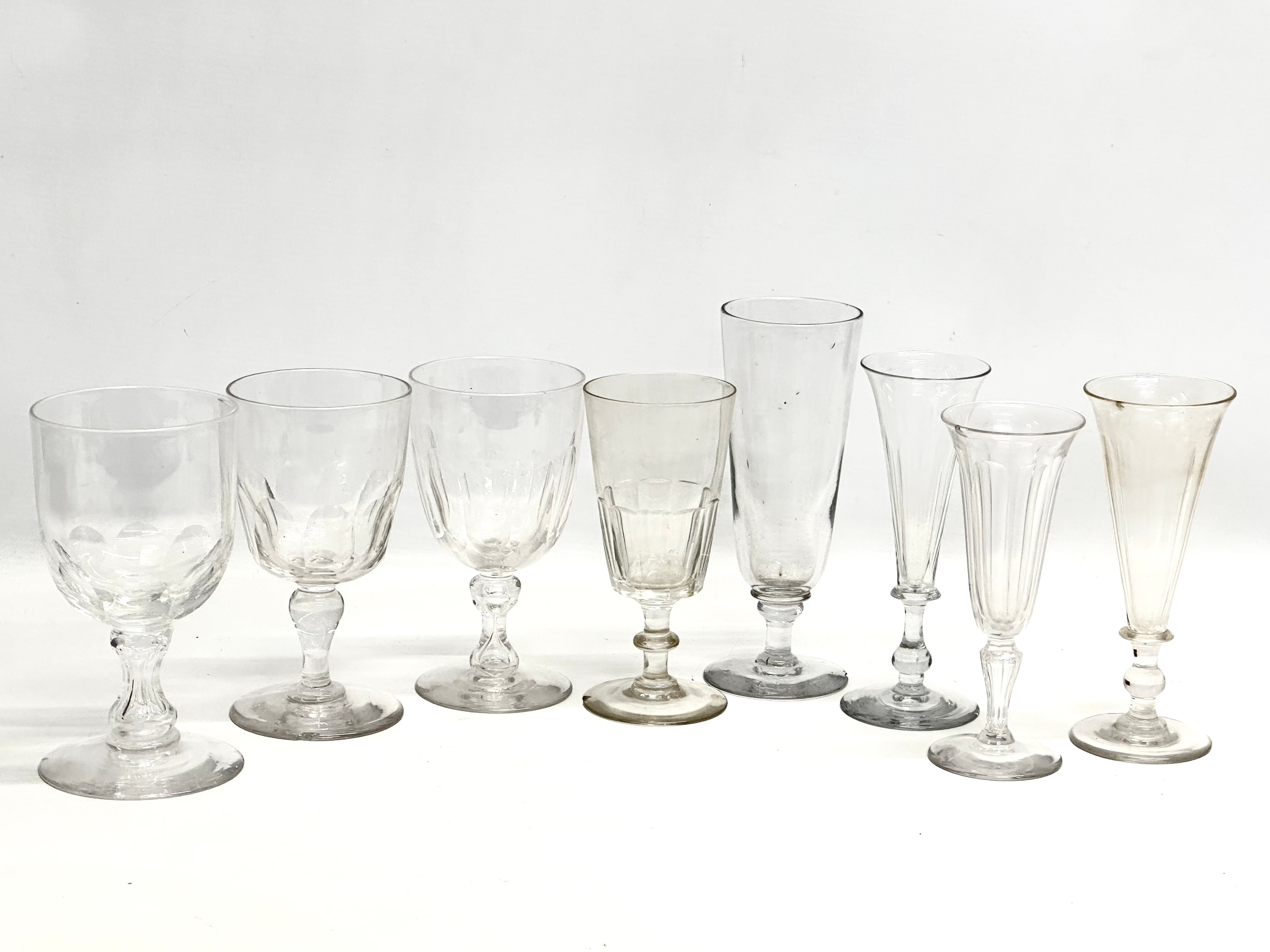 8 large 19th Century Victorian ale glasses. 20cm. 18cm. 17cm. Damaged.