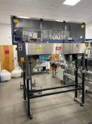 Kaps-All AU-3C Automatic Bottle Orientainer with hopper and conveyor.