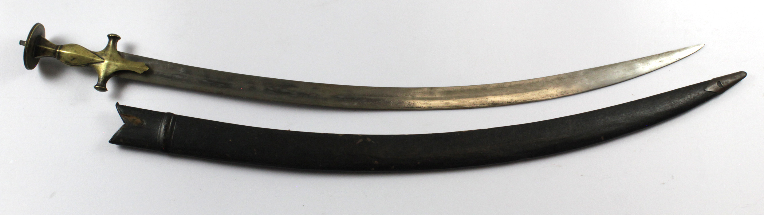 Swords two late 19th century Indian Tulwar both with scabbards.