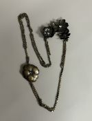 LOUIS VUITTON. SAUTOIR en métal