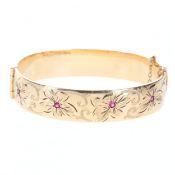 9ct Rolled Gold Bangle with Ruby Set Floral Design