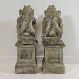 Pair of garden ornaments, columns with satyrs, 20th century