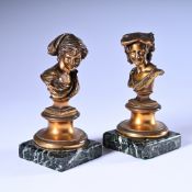 Charming pair of bronze busts of a young man and a young woman, on a square base of green veined mar