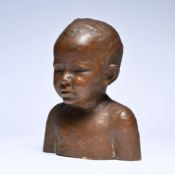 Brown patinated terracotta child's bust, illegibly signed