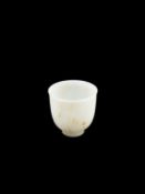 A WHITE AND RUSSETT JADE CUP, China, Qing dynasty, 18th / 19th century