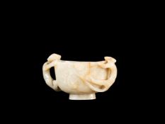 A JADE AND RUSSETT ‘QILONG’ LIBATION CUP, China, Ming dynasty (1368-1644)