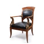 CARVED WOOD AND LEATHER ARMCHAIR, First half of the 19th century
