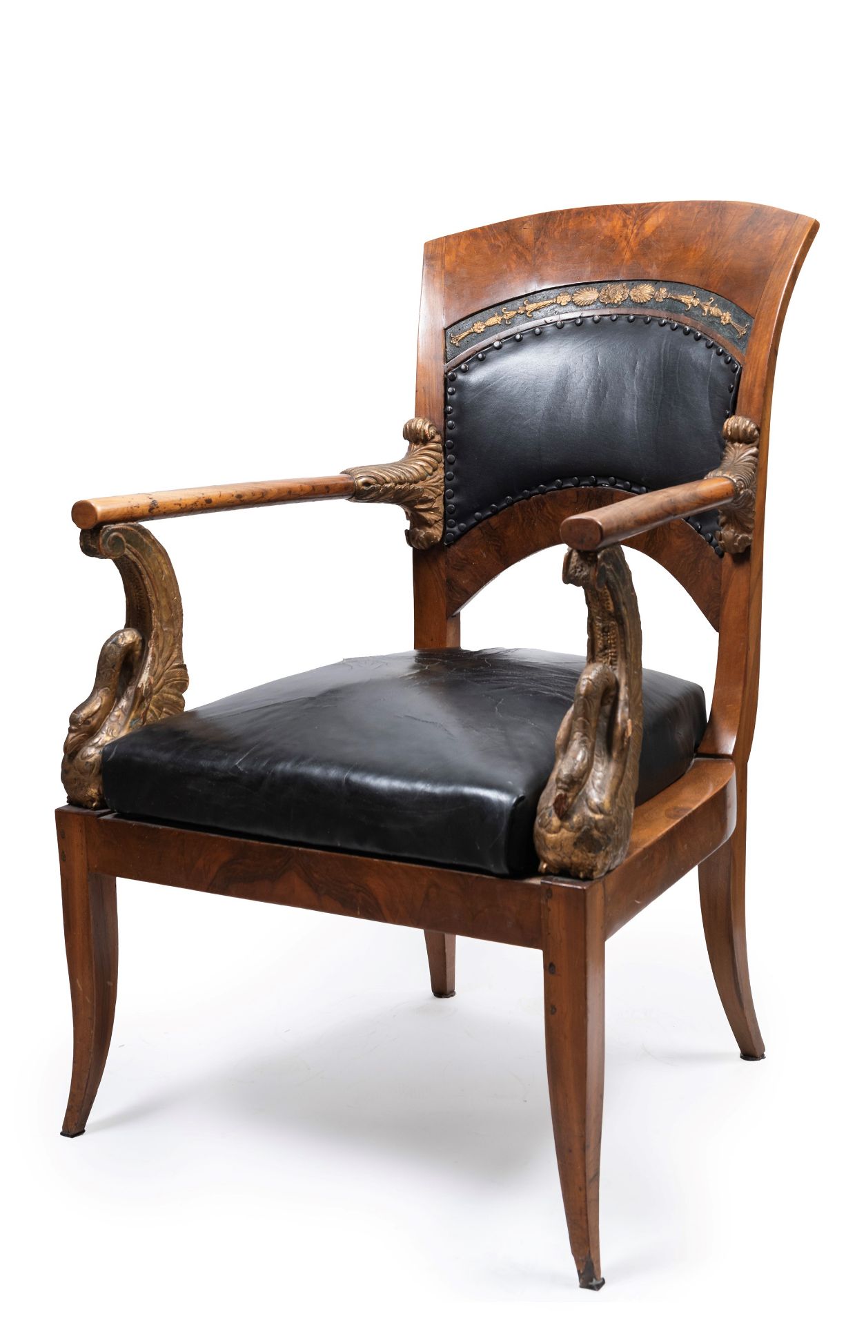 CARVED WOOD AND LEATHER ARMCHAIR, First half of the 19th century