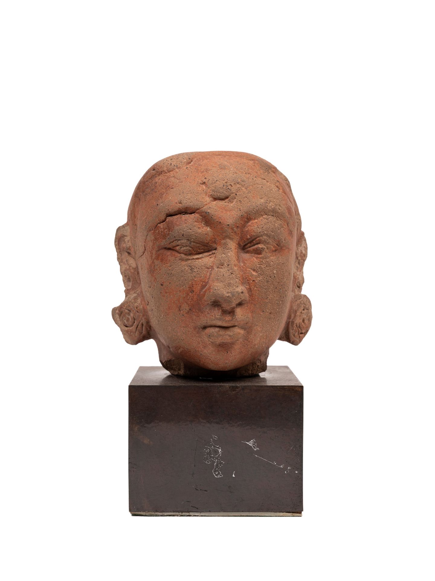 AN ANTIQUE INDIAN TERRACOTTA HEAD,
