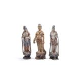 THREE POLYCHROME LACQUERED WOOD SCULPTURES DEPICTING TWO GUANYIN FIGURES AND ONE MALE FIGURE, China,