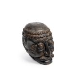CARVED WOODEN SCULPTURE DEPICTING A CITIPATI SKULL, Tibet, 20th century