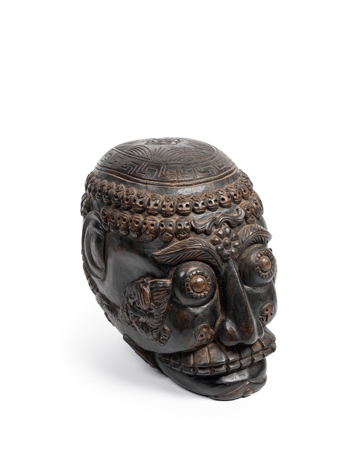 CARVED WOODEN SCULPTURE DEPICTING A CITIPATI SKULL, Tibet, 20th century