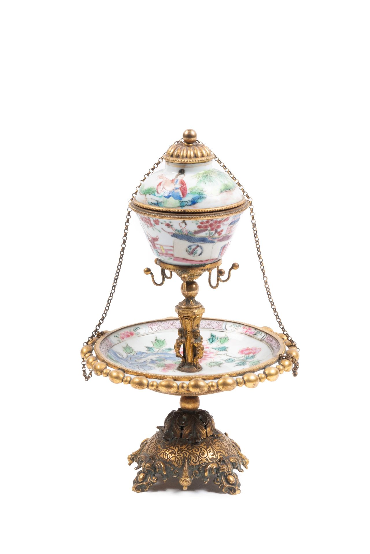 AN HORMOLU MOUNTED FAMILLE ROSE PORCELAIN CUP AND SAUCER, China, Qing dynasty, 18th century