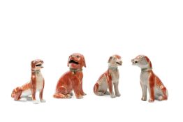 FOUR PORCELAIN FIGURES OF DOGS, China, Qing dynasty, 18th century