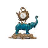 TABLE CLOCK WITH PORCELAIN ELEPHANT MOUNTED IN BRONZE, China, Qing dinasty, 19th century