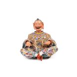 A MECHANICAL PORCELAIN MAGOT, Germany, 19th century