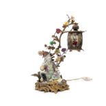 POLYCHROME PORCELAIN LAMP MOUNTED IN BRONZE DEPICTING A SEATED DIGNITARY, 19th century