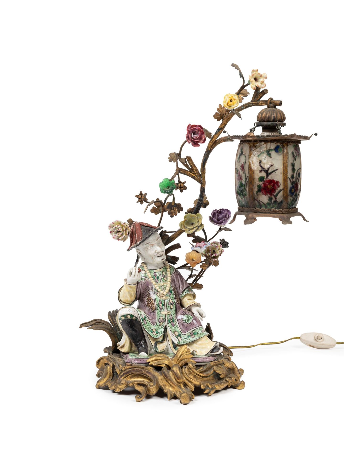 POLYCHROME PORCELAIN LAMP MOUNTED IN BRONZE DEPICTING A SEATED DIGNITARY, 19th century