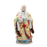 PORCELAIN SCULPTURE DEPICTING A SAGE HOLDING A PEACH, China, 20th century