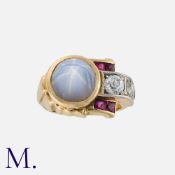 A Retro Star Sapphire, Ruby And Diamond Ring in 14k yellow gold and platinum, set with a principal